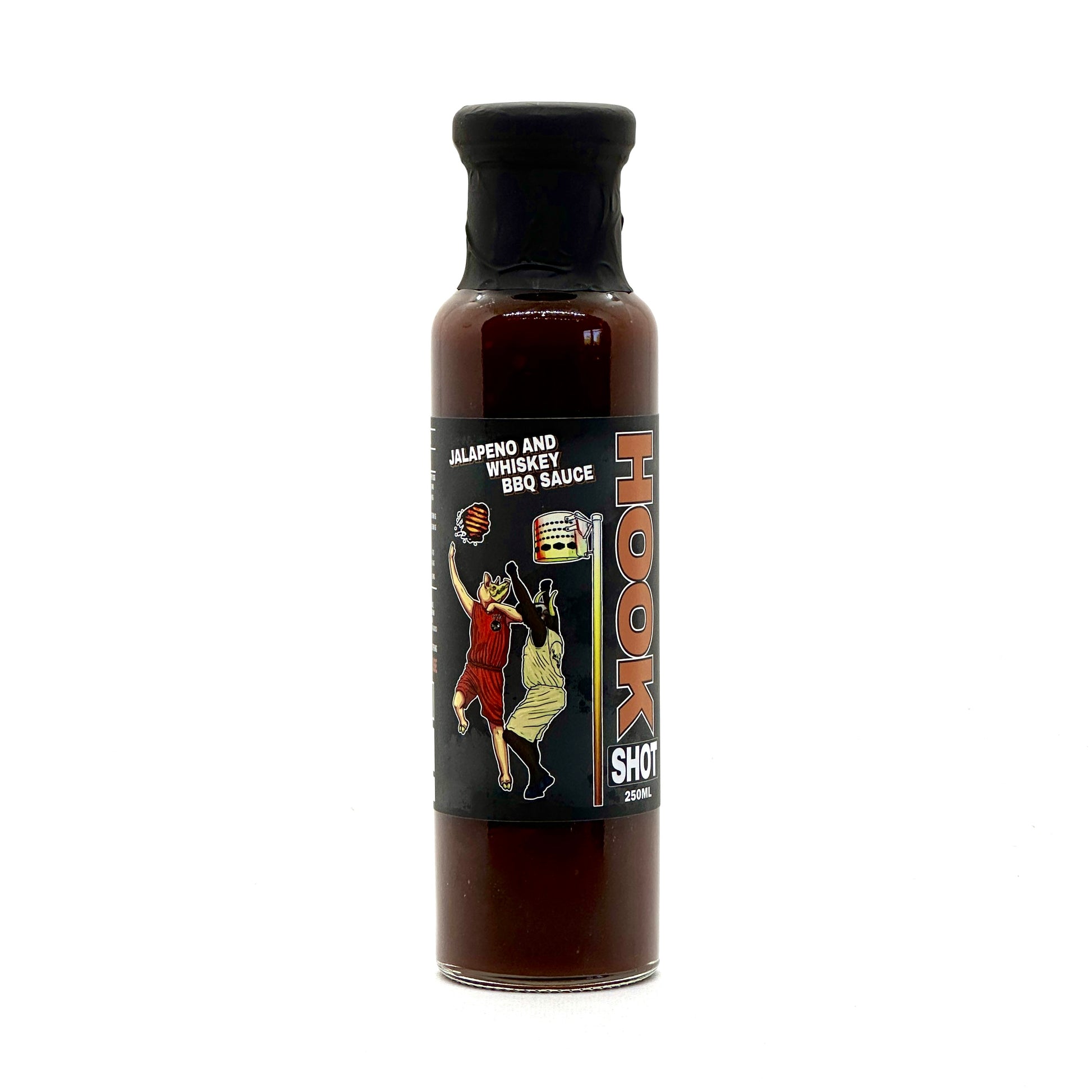 Bottle of Low 'n' Slow Basics Hook Shot Jalapeno and Whiskey BBQ Sauce displayed against a rustic background, highlighting its premium branding and flavor cues